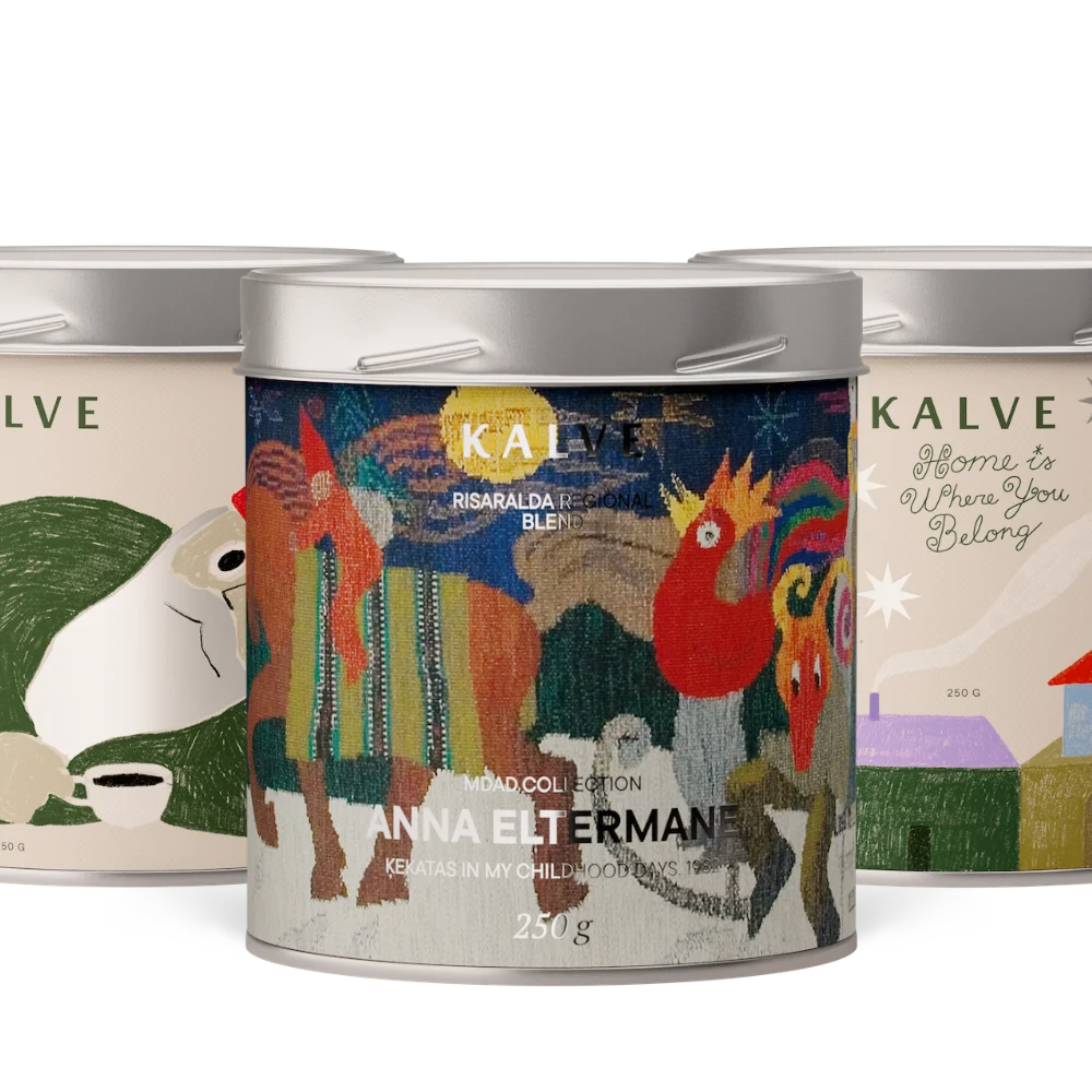 Three coffee tins with colorful labels featuring artistic designs and text.