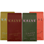 Four colorful 1kg bags of Kalve coffee with different flavors on a white background
