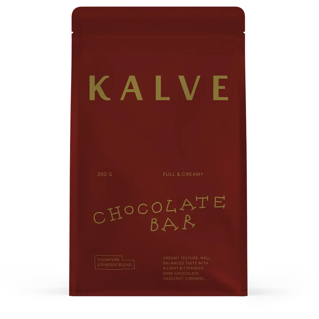 Red packaging of KALVE chocolate bar with gold text on a white background
