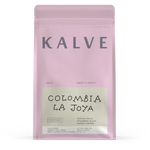 Pink coffee bag labeled 'Kalve Colombia La Joya' on a white background