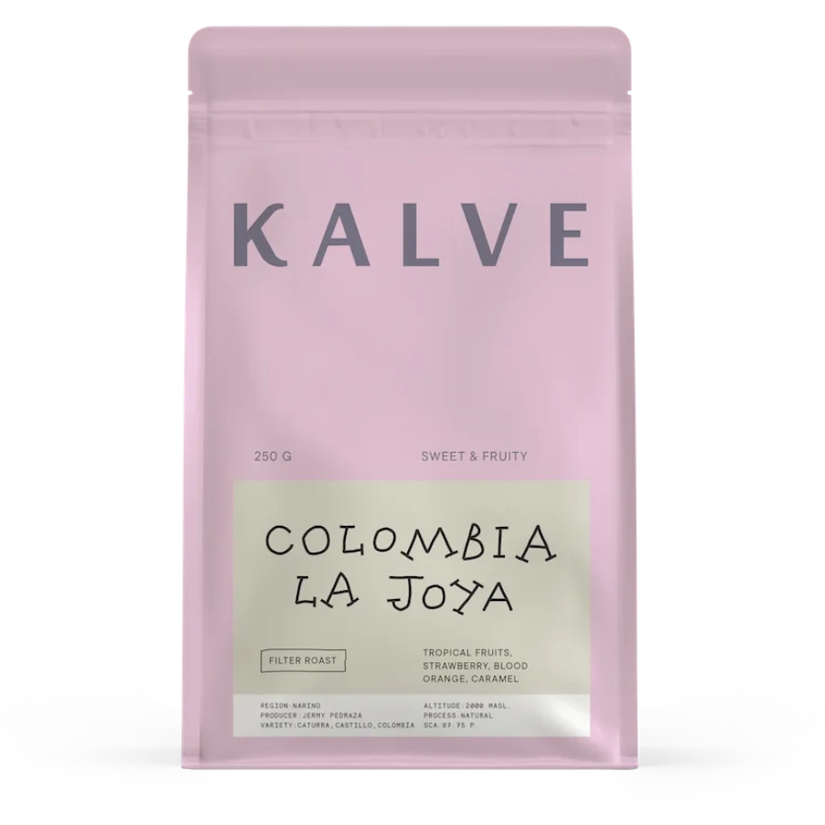 Pink coffee bag labeled 'Kalve Colombia La Joya' on a white background