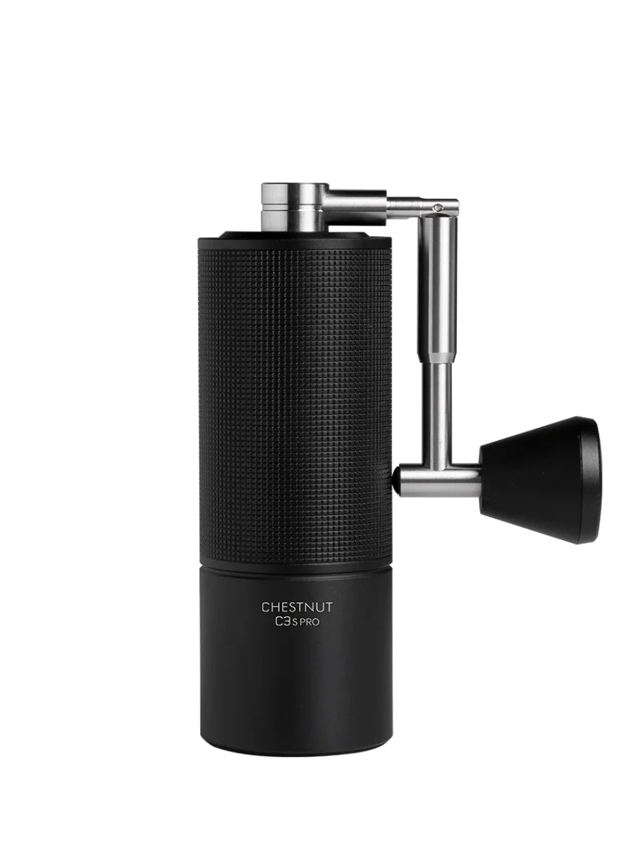 Black coffee grinder with metallic accents on a white background